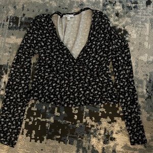 Black floral crop top from Subdued